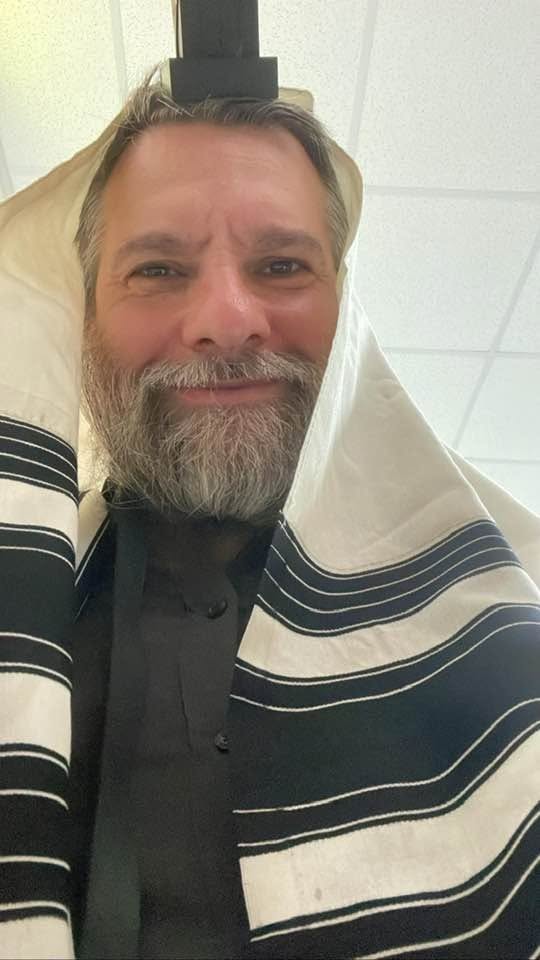 Rabbi Boruch Merkur in tallis and tefillin